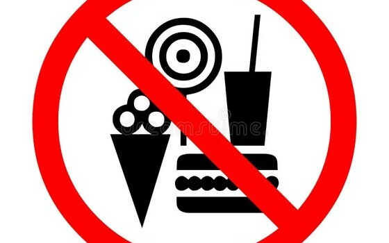 Graphics of a lolipop, burger, and ice cream behind a red circle with a line through it